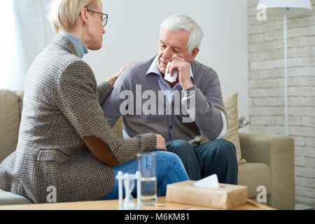 Senior Man Crying in Therapy Stock Photo