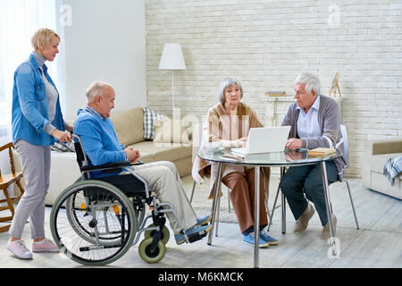 Senior People in Modern Retirement Home Stock Photo