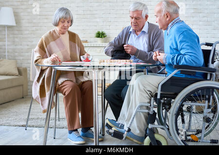 Senior Friends Playing Lotto Stock Photo