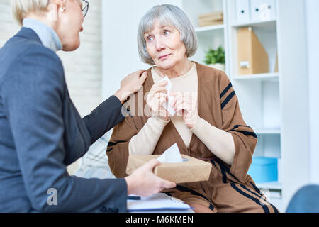 Crying Senior Woman in Therapy Stock Photo