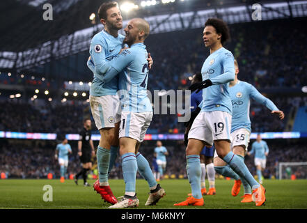 Manchester City's Bernardo Silva celebrates with David Silva, Leroy Sane, and Oleksandr Zinchenko during the Premier League match at the Etihad Stadium, Manchester. PRESS ASSOCIATION Photo. Picture date: Sunday March 4, 2018. See PA story SOCCER Man City. Photo credit should read: Nick Potts/PA Wire. RESTRICTIONS: No use with unauthorised audio, video, data, fixture lists, club/league logos or 'live' services. Online in-match use limited to 75 images, no video emulation. No use in betting, games or single club/league/player publications. Stock Photo