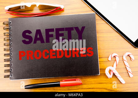 Handwriting Announcement text   Safety Procedures. Business concept for Accident Risk Policy Written on notepad notebook book wooden background in off Stock Photo