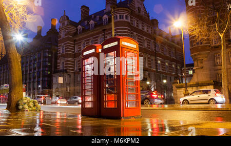 old telephone cabins in London city. Night scene Stock Photo