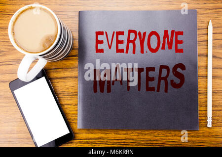 Handwriting Announcement text showing Everyone Matters. Business concept for Equality Respect Written on notepad note paper, wooden wood background co Stock Photo