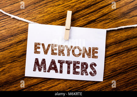 Handwriting Announcement text showing Everyone Matters. Business concept for Equality Respect written on sticky note paper on wooden background. Stock Photo