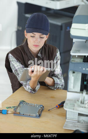 female technician using tablet computer Stock Photo