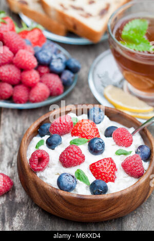 healthy  breakfast cottage cheese with berries and melissa tea Stock Photo