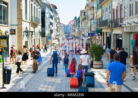 PORTO, PORTUGAL - JULY 15, 2017: Toruists walking on Santa Catarina street. Santa Catarina is a main shopping street of Porto. Stock Photo