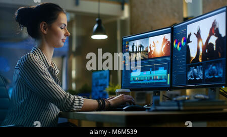 Female Video Editor Works with Footage and Sound on Her Personal Computer. She Works Late. Her Office is Modern and Creative Loft Studio. Stock Photo