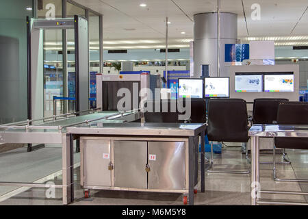 Checkpoint at the airport. X-ray scanner with monitors for detecting dangerous items of passengers. Stock Photo