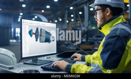 Inside the Heavy Industry Factory Industrial Engineer Works on the Personal Computer Designing Turbine/ Engine in 3D, Using CAD Program. Stock Photo