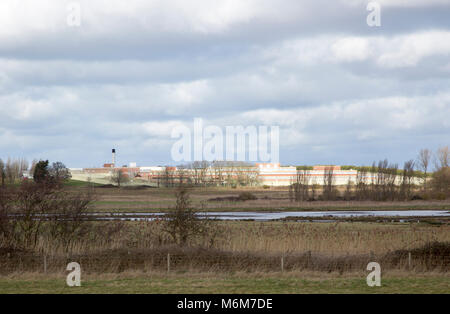 Wetland marshes landscape next to HMP Warren Hill prison, Hollesley Bay, Suffolk, England, UK Stock Photo