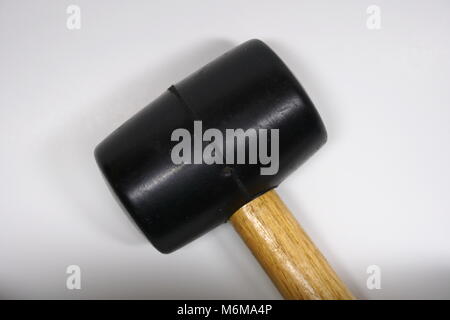 Isolated rubber mallet with wooden handle on a white background. Used for repair and hammer objects Stock Photo