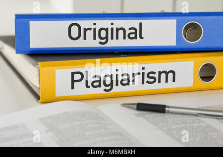 Folders with the label Original and Plagiarism Stock Photo