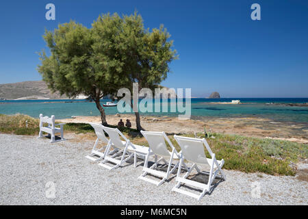 Deckchairs looking over the sea at Nefeli Sunset Studios, Pollonia, Milos, Cyclades, Aegean Sea, Greek Islands; Greece; Europe Stock Photo