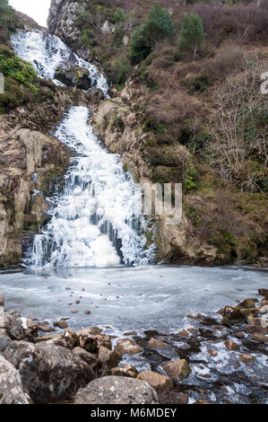 Assaranca Waterfall, Maghera, Ardara, County Donegal, Ireland. The waterfall frozen in winter. Stock Photo