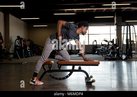 African man lifting a kettlebell Stock Photo