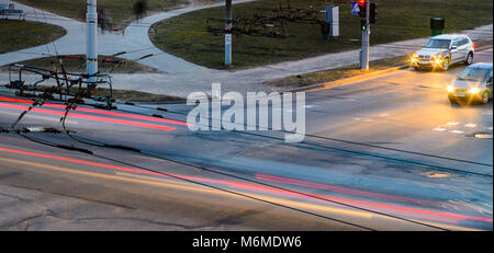 City intersection in the evening view from above. City traffic at night. Car light trails on city crossroad in the evening Stock Photo