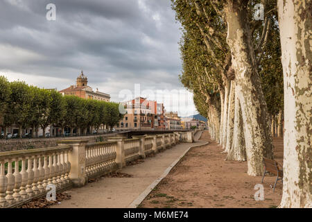 View of  La Bisbal d'Emporda and Plane tree lined Avenue 'Passeig Marimon Asprer' on the riverbank of Riu Daro, Baix Emporda, Catalonia, Spain Stock Photo