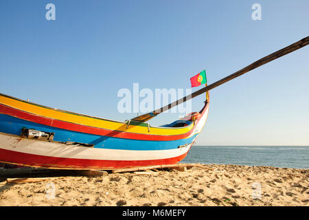 Typical old portuguese fishing boats on the beach of Espinho, Portugal Stock Photo