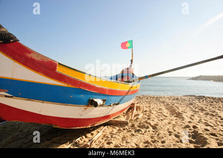 Typical old portuguese fishing boats on the beach of Espinho, Portugal Stock Photo