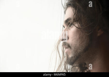 Handsome man with long hair profile Stock Photo