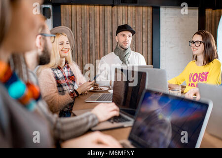 Coworkers during the conference indoors Stock Photo