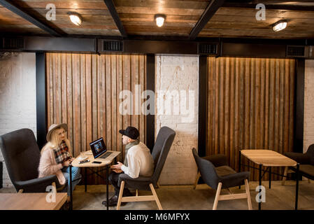 Couple sitting in the cafe Stock Photo