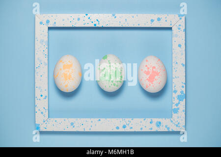 Framed artistic easter eggs with multicolored paint stains minimal concept Stock Photo
