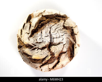 top view of a freshly baked round country bread on white background Stock Photo