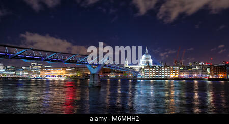 St Paul's Cathedral , the river Thames and the Millennium Bridge at night. London cityscape, showing illuminated bars and restaurants along the riverb Stock Photo