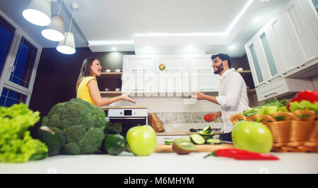 Couple Having Fun in Kitchen Stock Photo