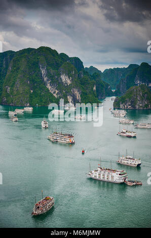 Cruise ships moored in Halong Bay viewed from the top of Titov Island, Vietnam on a stormy day Stock Photo