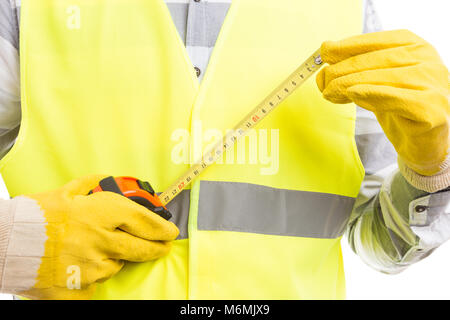Anonymous builder holding roll meter as renovation or building new house concept Stock Photo