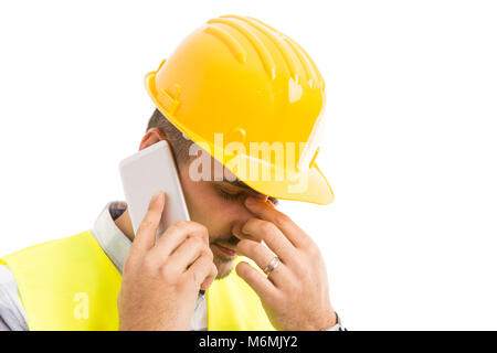 Stressed constructor or architect talking on the phone and feeling headache migraine concept Stock Photo