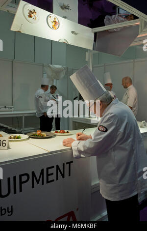 Chef cooking at the Hotelympia hospitality and food exhibition at the Excel conference centre London,UK Stock Photo