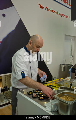 Chef cooking at the Hotelympia hospitality and food exhibition at the Excel conference centre London,UK Stock Photo