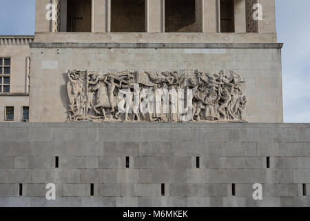 Bas-relief showing Allegory of Fascism and Allegory of Sanctions - University of Trieste building, Trieste, Italy Stock Photo