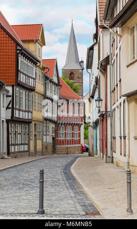 Street with old houses and a high stone tower. Quedlinburg. Germany Stock Photo