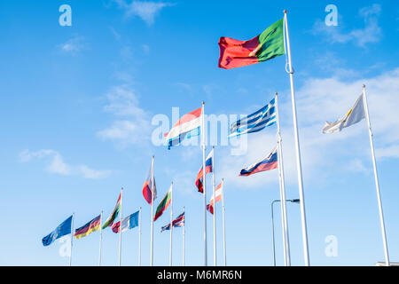 EU  flags. Many flags from the various nations of the European Union flying in the wind against a blue sky, Hull, England, UK Stock Photo