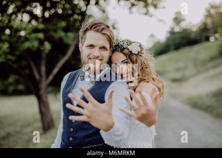 Beautiful bride and groom in green nature. Stock Photo