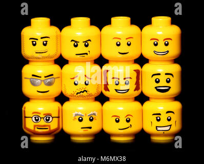 lego heads on a black background Stock Photo - Alamy