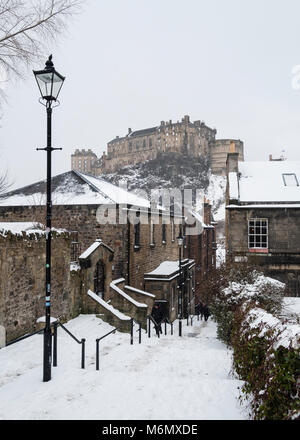 View of Edinburgh Castle after snow from the historic Vennel steps at Grassmarket in Edinburgh Old Town, Scotland, United Kingdom Stock Photo