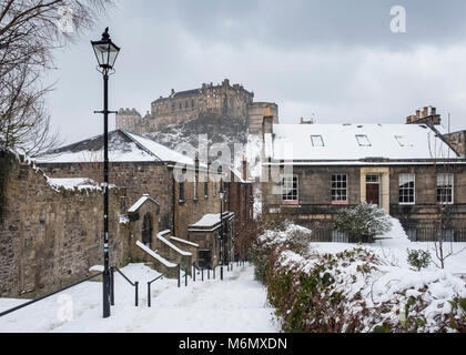 View of Edinburgh Castle after snow from the historic Vennel steps at Grassmarket in Edinburgh Old Town, Scotland, United Kingdom Stock Photo