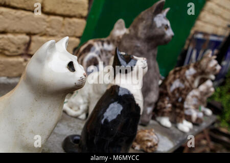 A collection of Winstanley pottery cats arranged outdoors. North Walsham, Norfolk, UK. Stock Photo