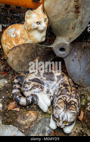 A collection of Winstanley pottery cats and rabbits arranged outdoors. North Walsham, Norfolk, UK. Stock Photo