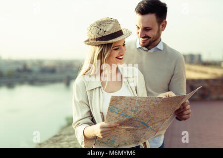 Tourist couple using map as guide Stock Photo