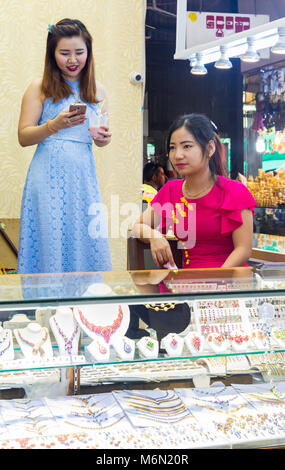 Market stall holders selling jewellery at Bogyoke Aung San Market, formerly Scott's Market, Yangon, Myanmar (Burma), Asia in February Stock Photo