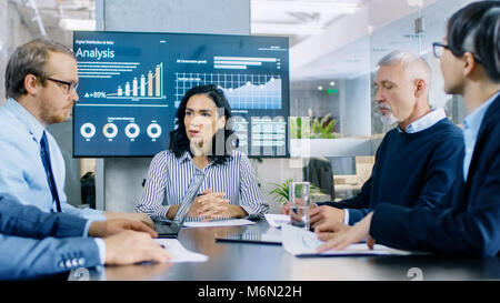 Diverse Group of Successful Business People in the Conference Room Discuss Company's Matters. They Work on a Company's Growth Stock Photo