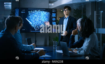 In the Conference Room Chief Engineer Presents to a Board of Scientists New Revolutionary Approach for Developing Artificial Intelligence Stock Photo